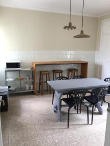 a kitchen with a table and chairs in a room at Beaucoeur in Aosta