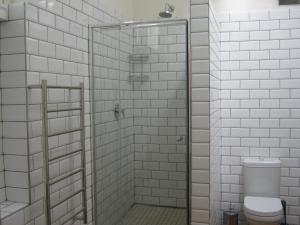 a bathroom with a shower with a toilet at Jetty Self-Catering in Swakopmund