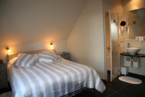 Letto o letti in una camera di B&B Artiriacumhoeve