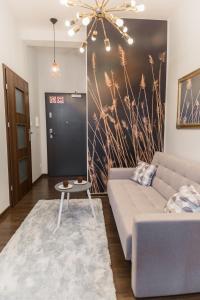 Posteľ alebo postele v izbe v ubytovaní GoldenEye Apartment Center