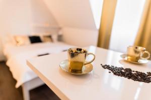 Posteľ alebo postele v izbe v ubytovaní GoldenEye Apartment Center