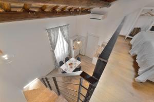 Posteľ alebo postele v izbe v ubytovaní Sarpi Loft Florence