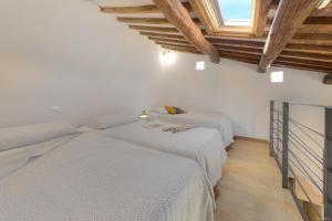 Posteľ alebo postele v izbe v ubytovaní Sarpi Loft Florence