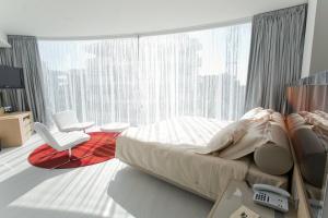 Кровать или кровати в номере Hotel Waldorf- Premier Resort