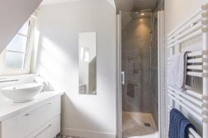 a bathroom with a shower and a sink at Chambres "Le Tirel " in Reux