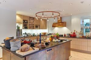 a kitchen with a large island with food on it at Hotell Stadsparken in Helsingborg