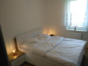 Posteľ alebo postele v izbe v ubytovaní Apartament Limonkowy Kołobrzeg Podczele