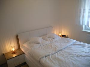 Posteľ alebo postele v izbe v ubytovaní Apartament Limonkowy Kołobrzeg Podczele
