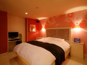 Posteľ alebo postele v izbe v ubytovaní Hotel Birthday Kakamigahara