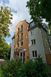 a building in front of a building at C-YOU Hotel Chemnitz in Chemnitz