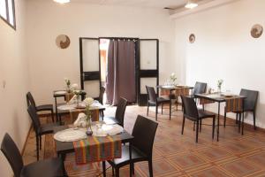 a group of tables and chairs in a room at Ouaka in Ouagadougou