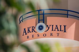 a sign for aarv waikiki resort is shown at Akroyiali Resort in Vasiliki