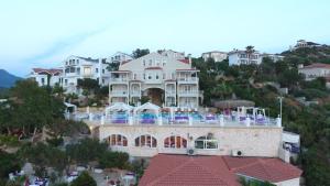 a large white house on top of a hill at Lukka Exclusive Hotel – Adult Only +12 in Kaş