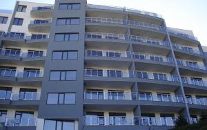 an apartment building with balconies on the side of it at Dilov Apartments in Yalta Golden Sands in Golden Sands