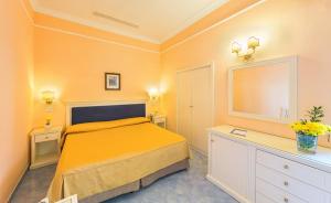 Posteľ alebo postele v izbe v ubytovaní Hotel Iaccarino