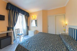 Posteľ alebo postele v izbe v ubytovaní Hotel Iaccarino