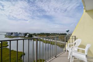 
a view from the balcony of a house overlooking the water at Sea Bay Hotel in Ocean City
