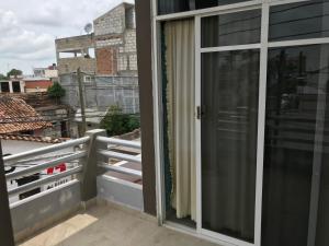 a balcony with a view of a building at Hotel Central ParQ in Tonalá