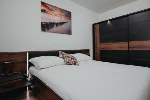 Postel nebo postele na pokoji v ubytování Apartman Vejama