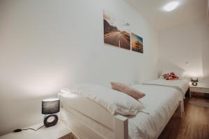 Postel nebo postele na pokoji v ubytování Apartman Vejama