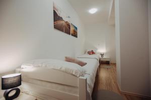 Postel nebo postele na pokoji v ubytování Apartman Vejama