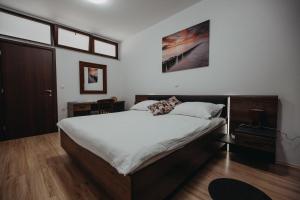 Postel nebo postele na pokoji v ubytování Apartman Vejama
