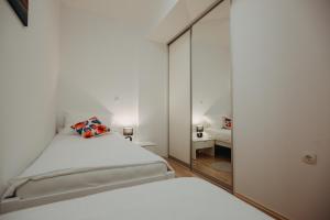 Postel nebo postele na pokoji v ubytování Apartman Vejama