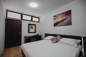 Llit o llits en una habitació de Apartman Vejama