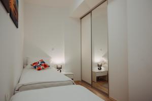 Postel nebo postele na pokoji v ubytování Apartman Vejama