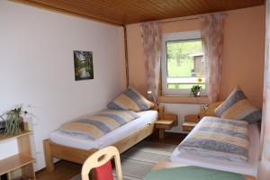 Uma cama ou camas num quarto em Moosberg Haus Mizzi