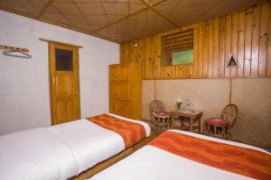 Tempat tidur dalam kamar di Everest Manla Resort