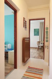 a hallway with a door open to a living room at Apartment Vista in Tolmin