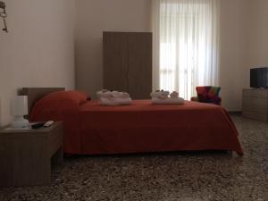 Postel nebo postele na pokoji v ubytování B&B Zia Iaia