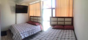 A-Hope Suite Hotel客房内的一张或多张床位