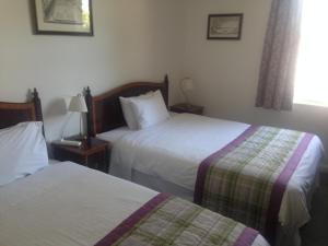 Een bed of bedden in een kamer bij Ashleigh House