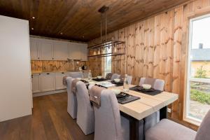 a kitchen and dining room with a table and chairs at Trysilsetra 40 in Trysil