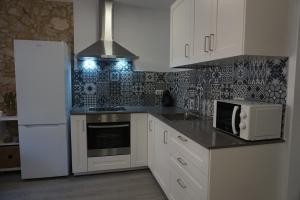 Kuchyň nebo kuchyňský kout v ubytování BOREAS Apartaments