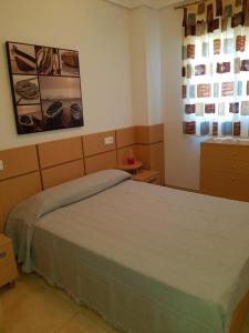 Postel nebo postele na pokoji v ubytování Apartamentos Jardines del Mar II