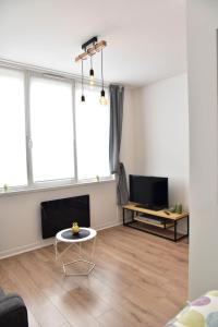 Posezení v ubytování Au Studio 36 Arras avec parking privé