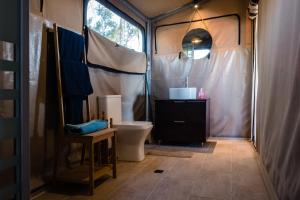 a bathroom with a tent with a toilet and a sink at Camping Elizabeth in Rethymno +124 photos