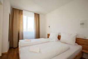 Postel nebo postele na pokoji v ubytování Outlet-Apartment Metzingen