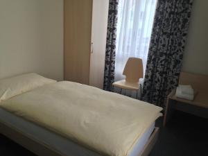 Rúm í herbergi á Hotel Central
