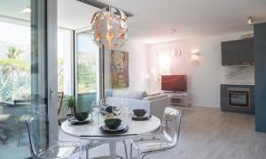 a living room with a white table and chairs at Paulina in Dubrovnik +17 photos