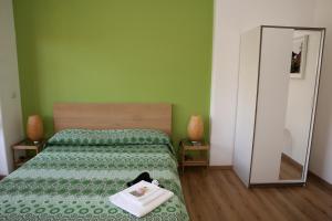 Posteľ alebo postele v izbe v ubytovaní Tosca B&B