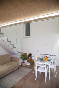 a living room with a couch and a table at Le Dimore Di Puglia - Palazzo Pinto in Monopoli