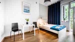 Posteľ alebo postele v izbe v ubytovaní Sereno Apartments