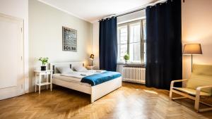 Posteľ alebo postele v izbe v ubytovaní Sereno Apartments