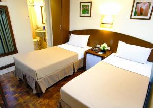 A bed or beds in a room at Fersal Hotel - Manila