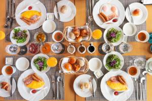 a table with plates of food on a table at Garden Terrace Nagasaki Hotels & Resorts in Nagasaki