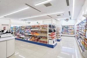 a store aisle of a grocery store with shelves of goods at Hotel Emion Tokyo Bay in Tokyo